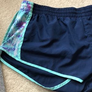 Navy running shorts w/ purple/seafoam green print